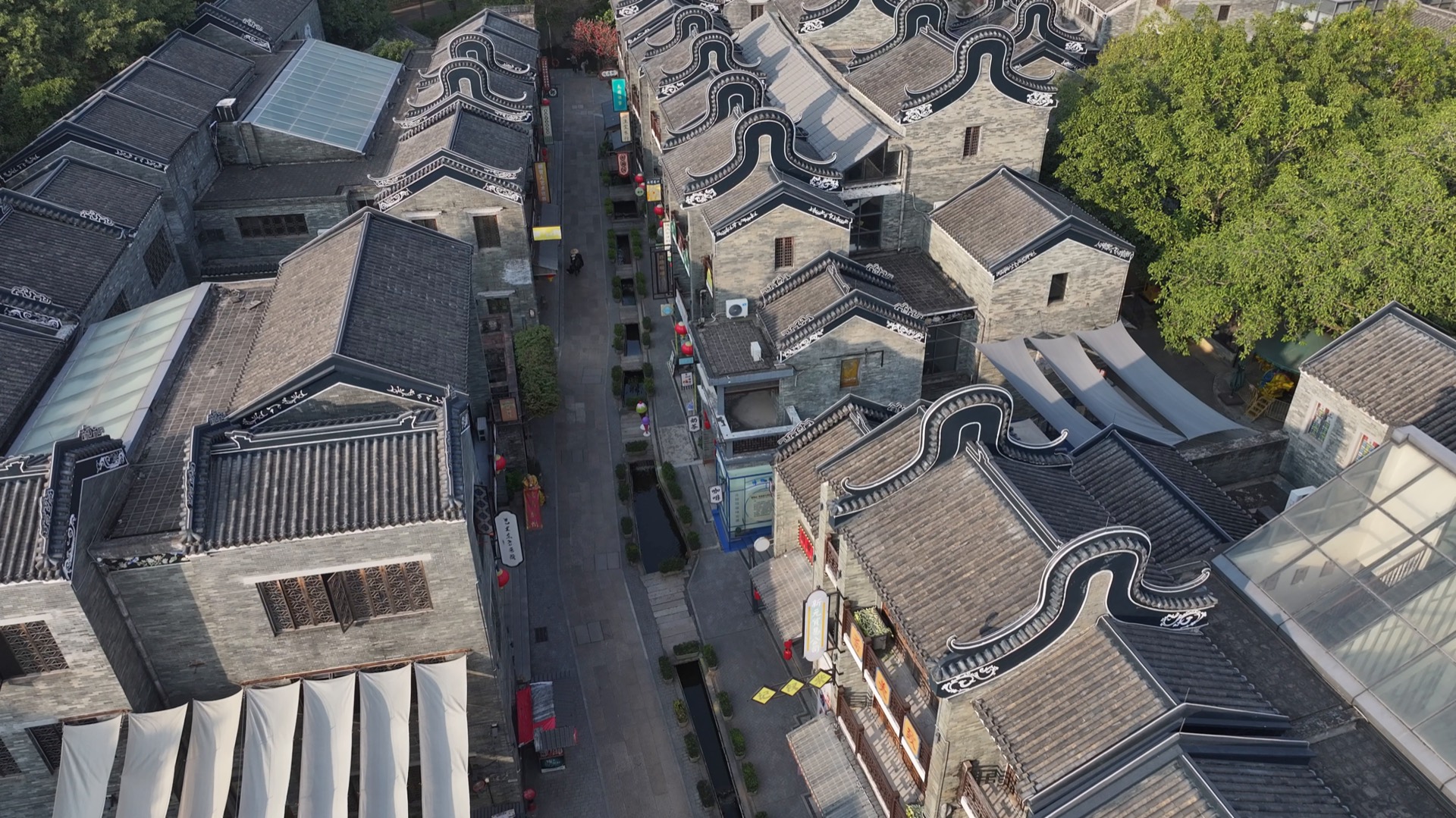 A UAV view over a dense heritage courtyard block with detailed roof structures.
