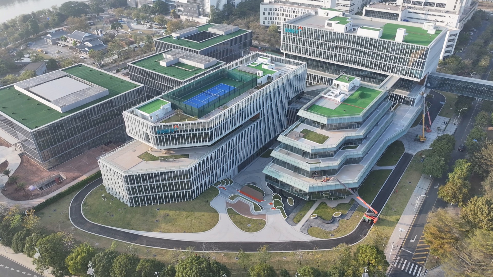 A UAV view of a contemporary campus with layered building volumes and road networks.
